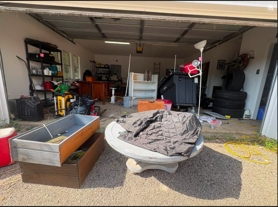 Cluttered garage before junk removal